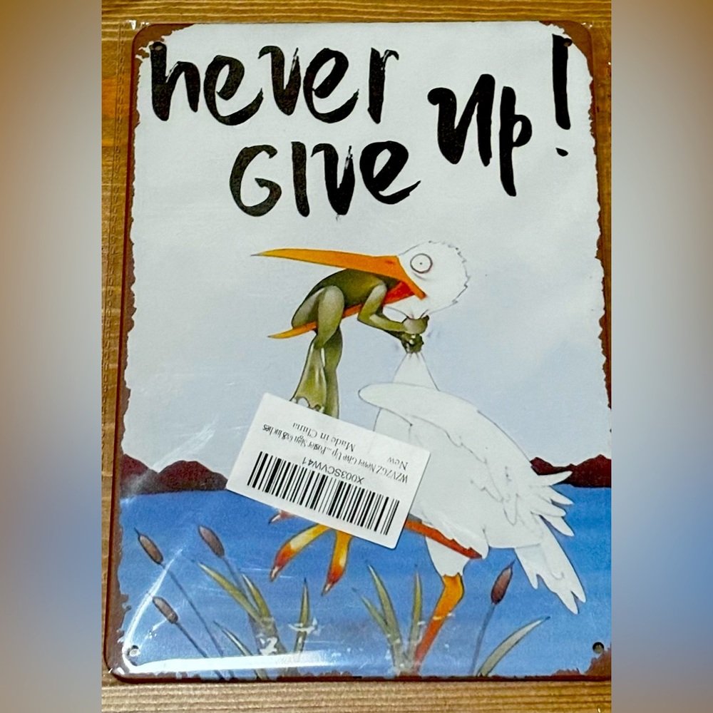 “ Never Give Up “ ( sign )